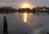 Sunrise view from a houseboat anchored in the lake.